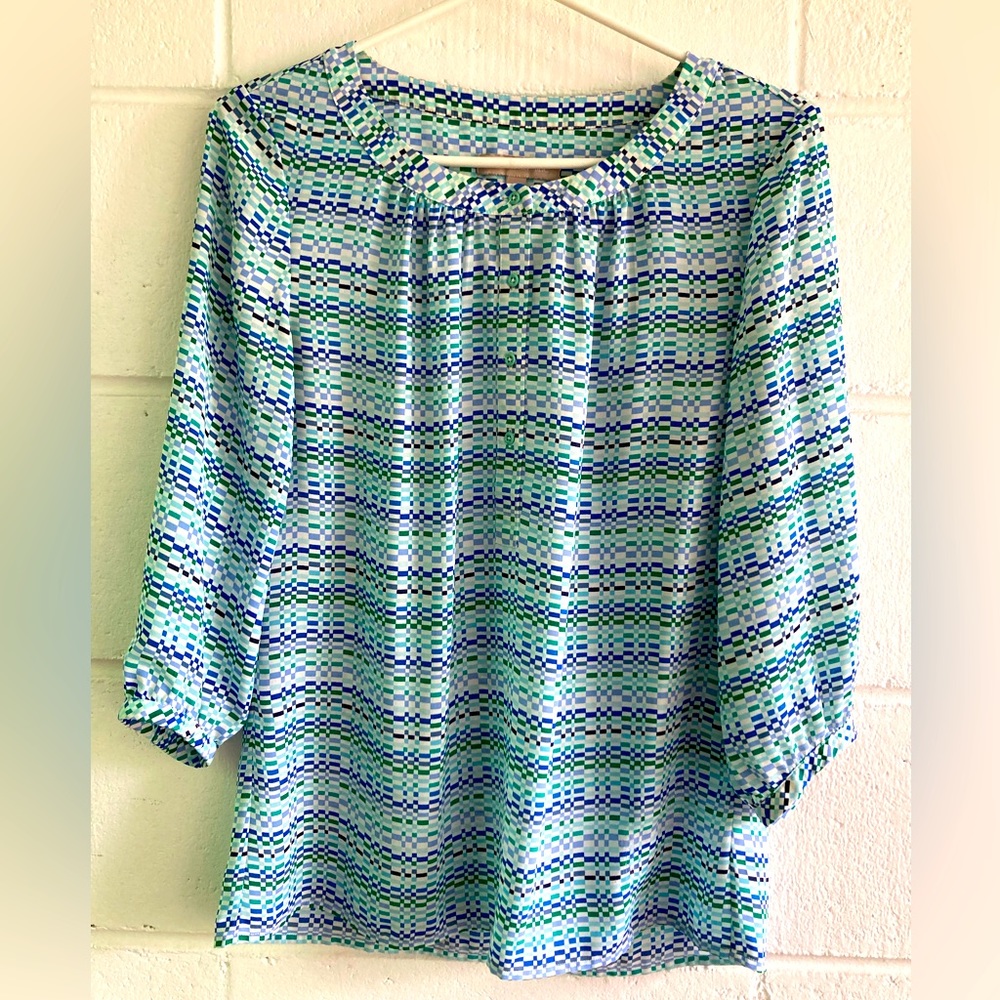 Long- sleeve shirt with green/blue checks; round neck, gathered sleeves.